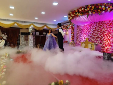 A groom and bride dancing at their wedding, celebrating their special day with memorable moments.