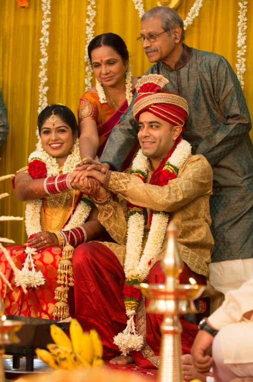 A wedding planner skillfully coordinates an elegant and colorful decorations and traditional customs
