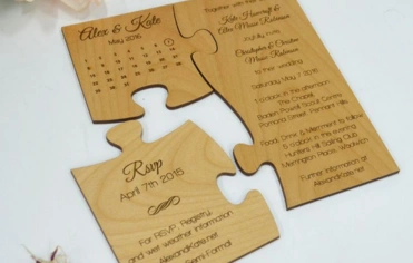 Elegant wooden wedding invitations with designs, perfect for a rustic or nature-themed celebration.