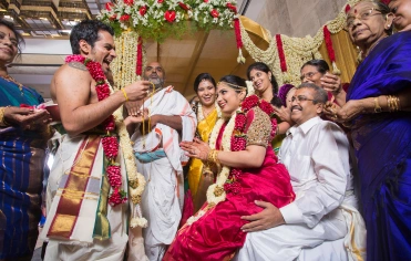 Joyful Indian wedding with guests in traditional attire, reflecting the event's rich cultural tapestry