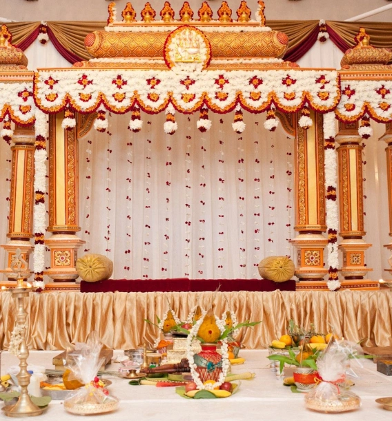 The wedding stage, decorated in rich gold, provided a luxurious backdrop for the celebration of love
