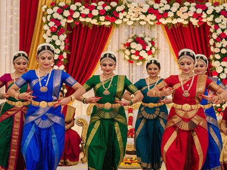 Bharatanatyam performers, clad in traditional Indian attire, showcase cultural elegance and artistry