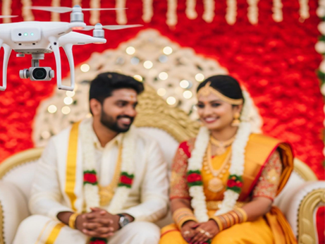During a wedding in Kerala, India, the groom gets his makeup applied amidst vibrant decorations