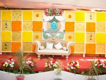A arranged wedding reception featuring white and blue tables & chairs, creating a festive atmosphere.